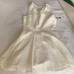 Sleeveless off white party dress.